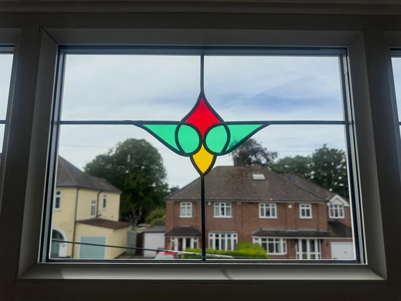 Clear replacement stained-glass sealed unit after failed-unit swap by Pane Relief, Bristol