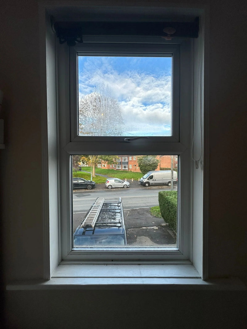 Broken shattered double glazed window glass with both panes cracked in Bristol