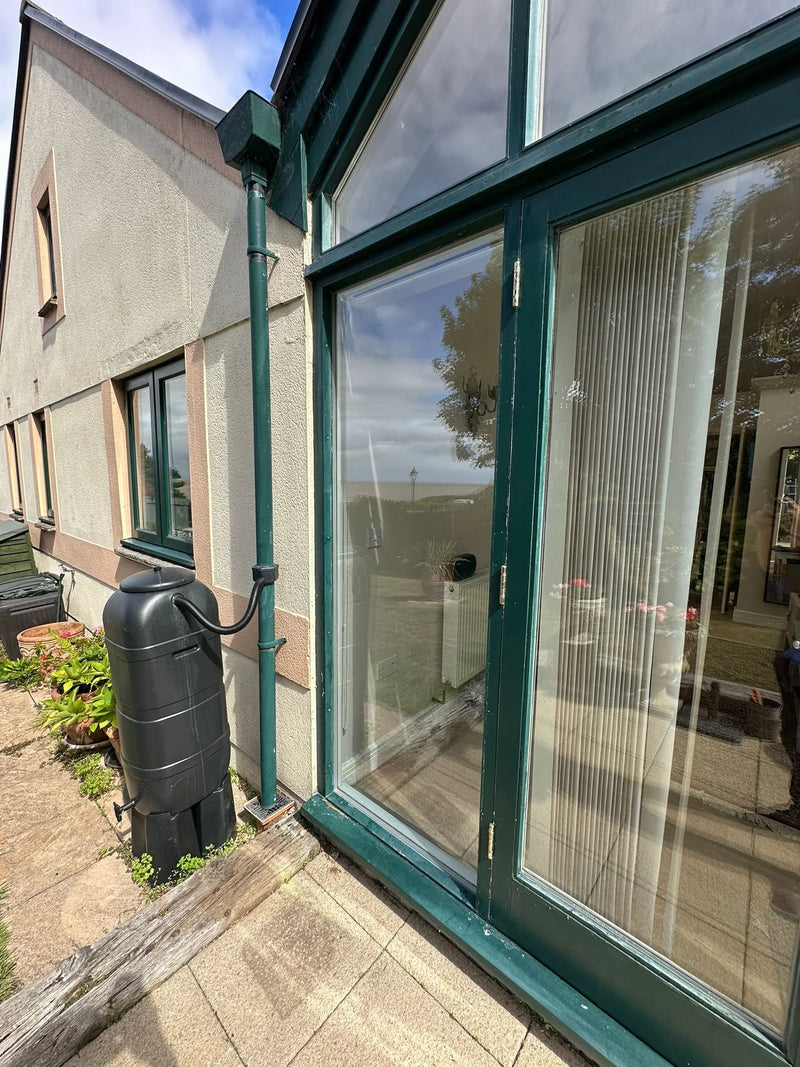 Conservatory patio doors after glass replacement with green frame in Bristol