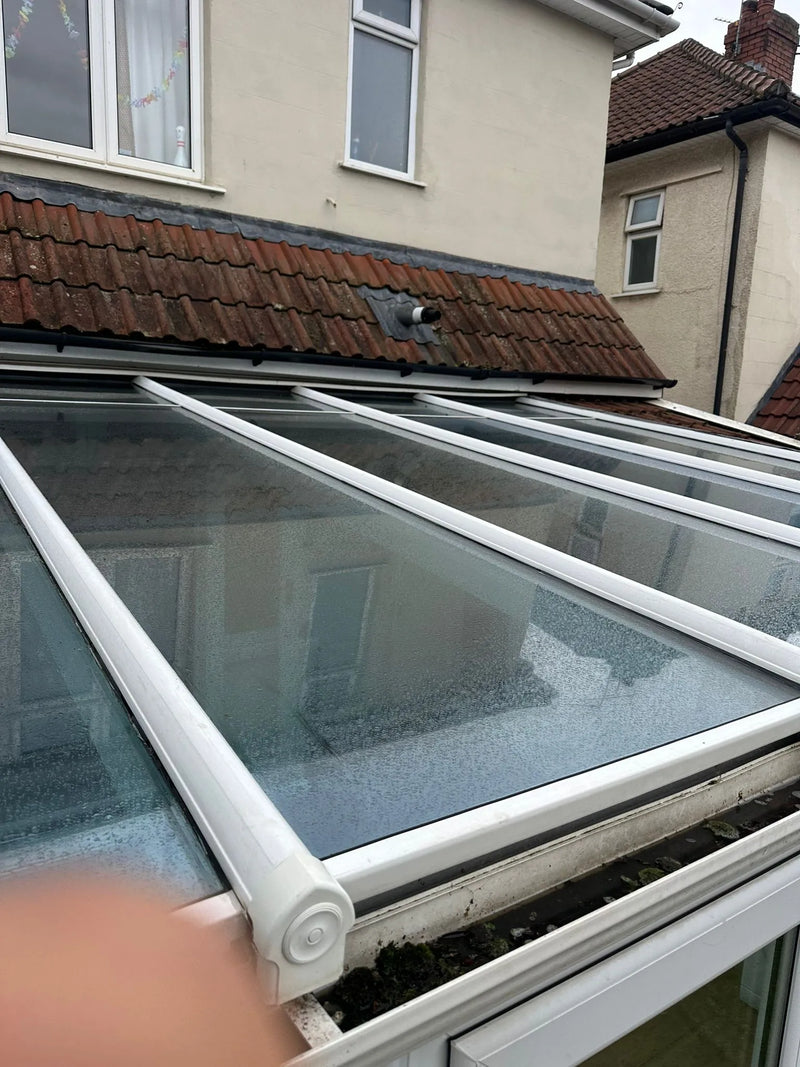 Conservatory roof glazing before resealing failed seals in Bristol home