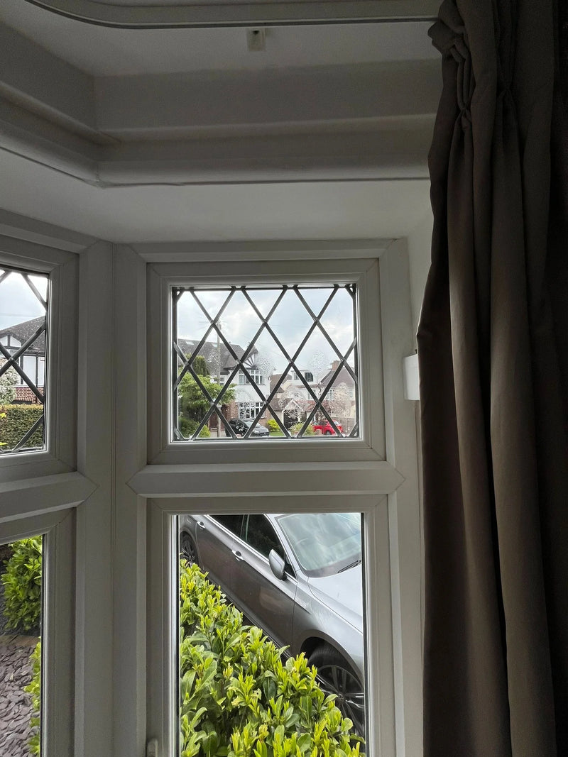 Diamond leaded bay window with misted pane before repair in Bristol