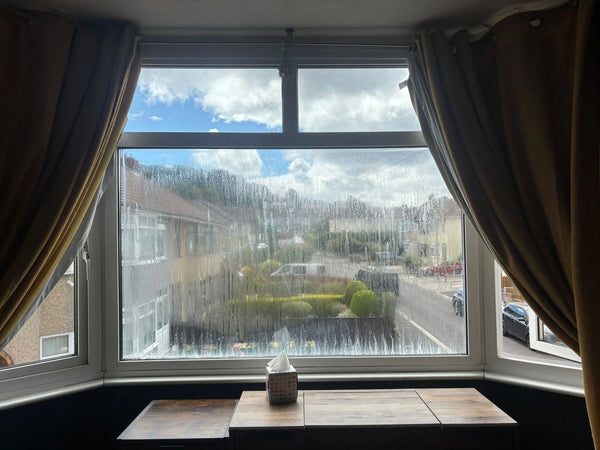 Draughty bay window with heavy misting showing poor insulation in Knowle, Bristol