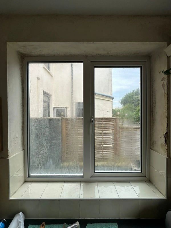 Draughty window causing damp and mould on walls and ceiling in Bristol