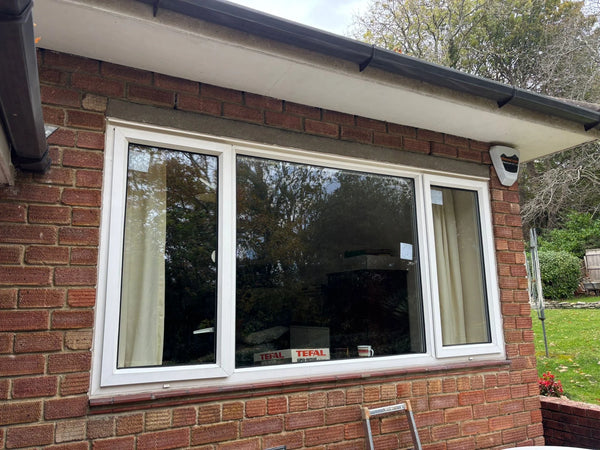 Exterior view of failed double glazing causing heat loss and cold rooms in Bristol