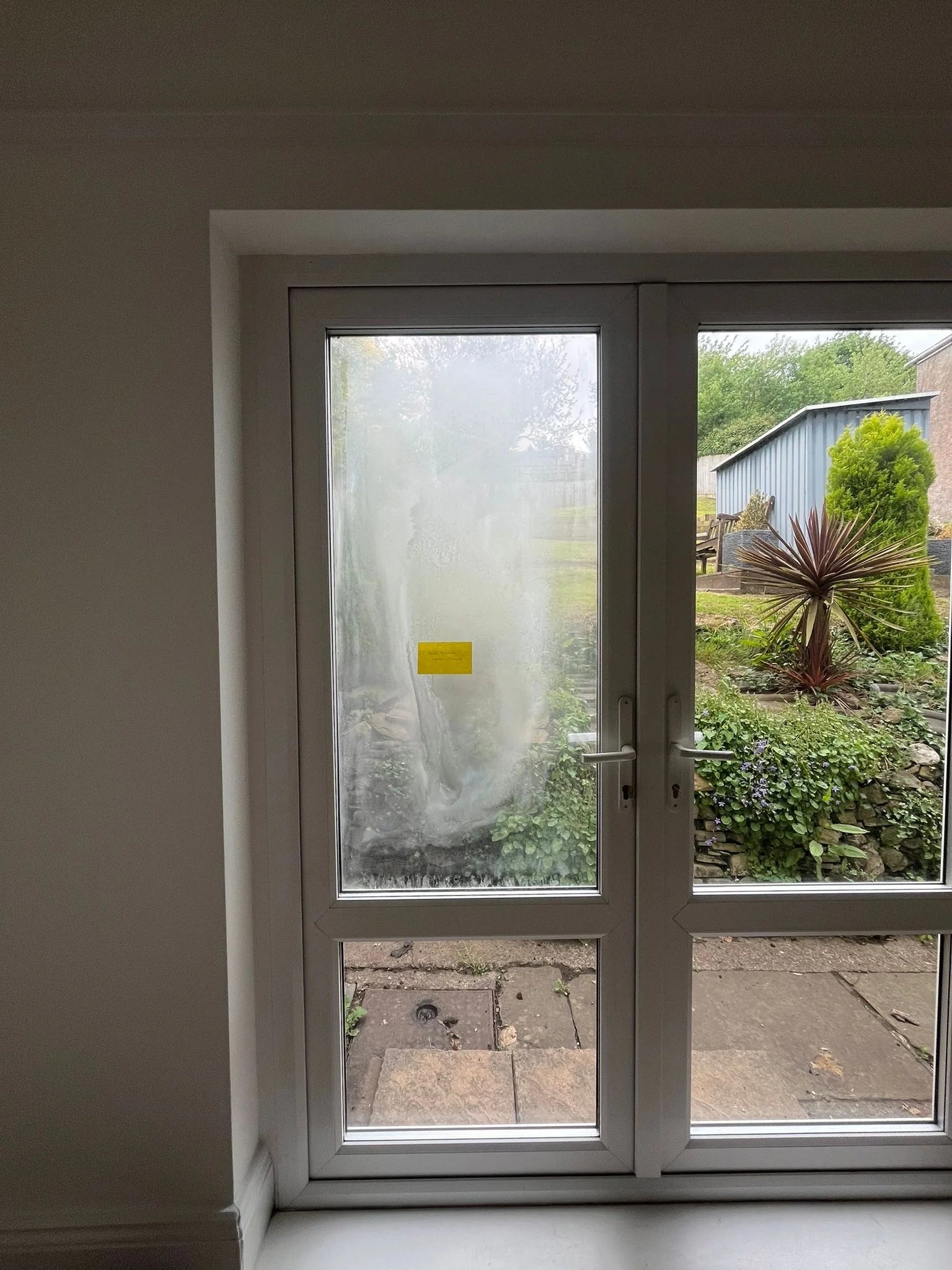 Failed seal comparison showing misted vs clear French door panes in Bristol
