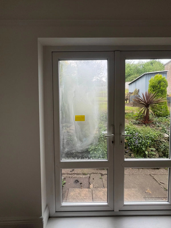 Failed seal comparison showing misted vs clear French door panes in Bristol