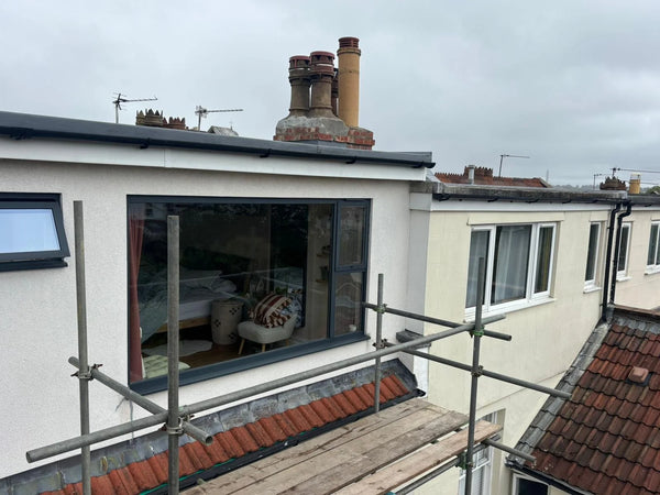 Loft conversion window and skylight installation with scaffolding in Bristol