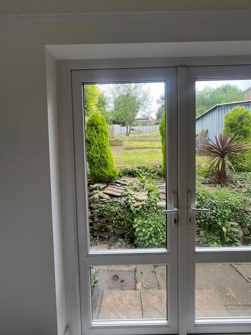 New clear French door glass replacement with garden view in Bristol