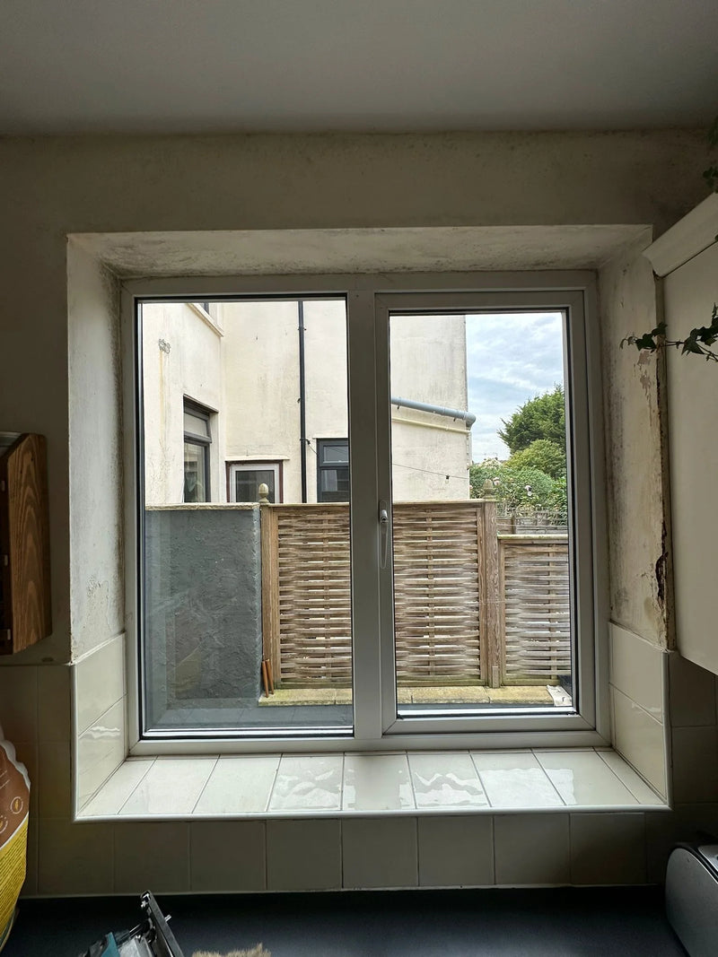 New sealed unit fitted in emergency window replacement showing previous damp damage in Bristol