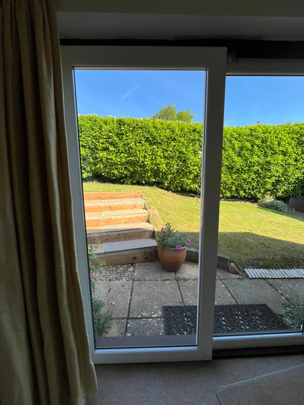 Patio door with new double glazed unit installed showing clear garden view near Bristol